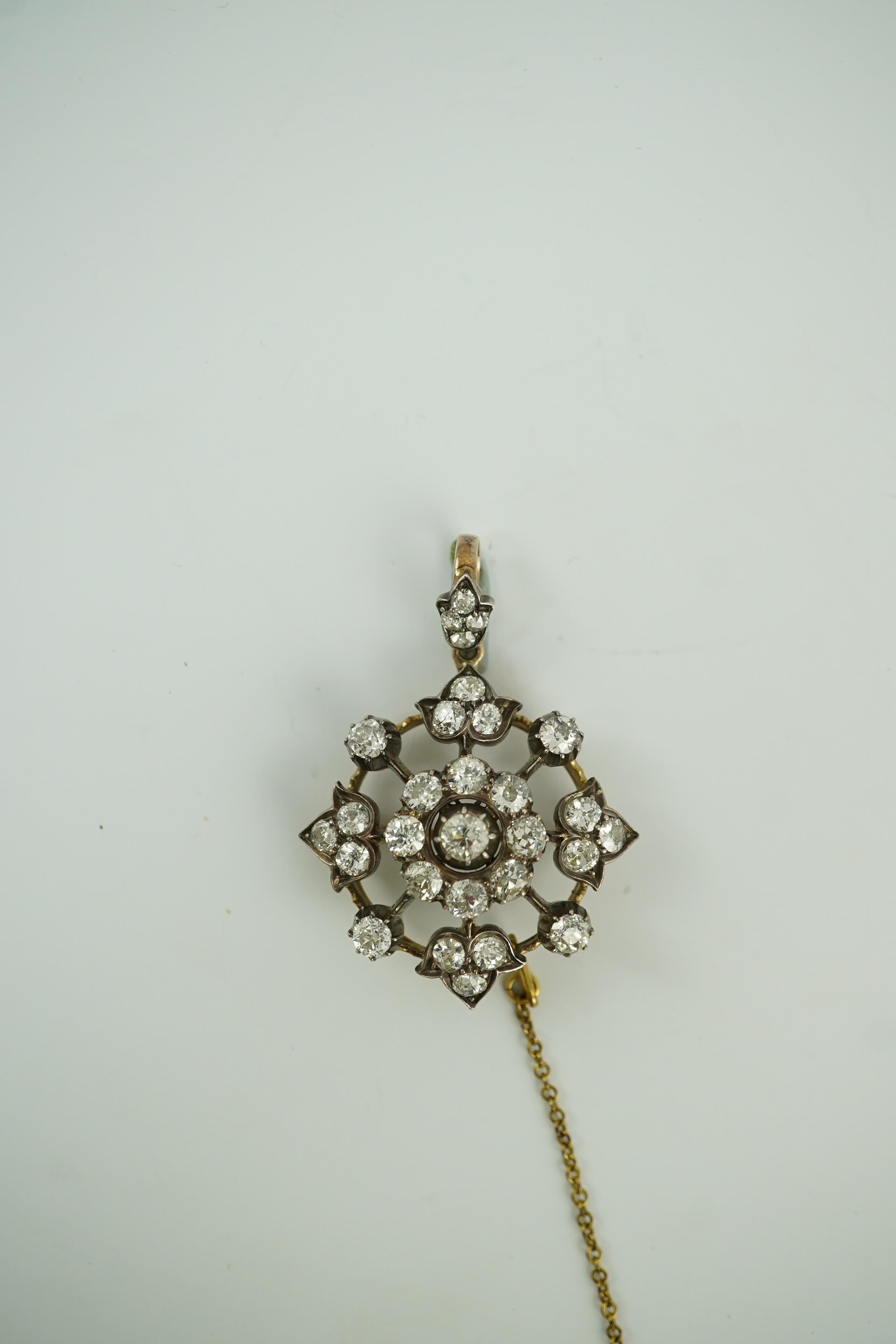 A late Victorian gold, silver and diamond cluster circular pendant brooch